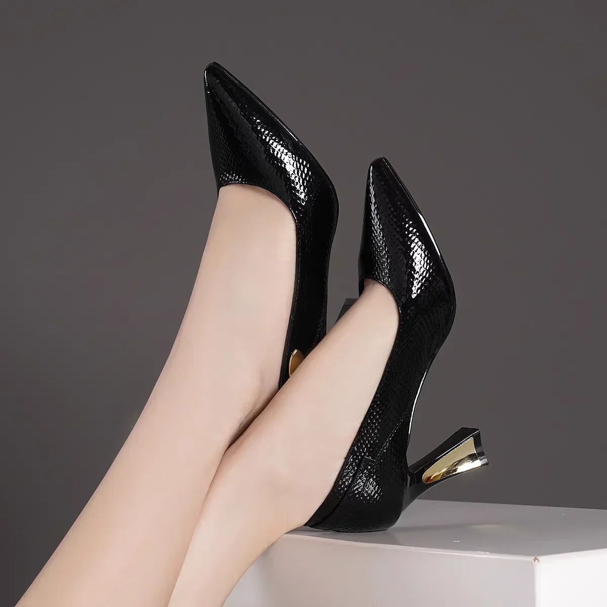 EtherealBe elegant designer party pumps in black with a stylish pointed toe and decorative heel