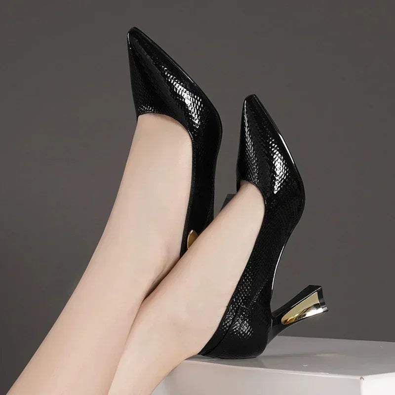 EtherealBe elegant designer party pumps in black with a stylish pointed toe and unique heel design