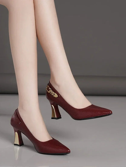 Stylish burgundy elegant designer party pumps with a classy gold accent for special occasions
