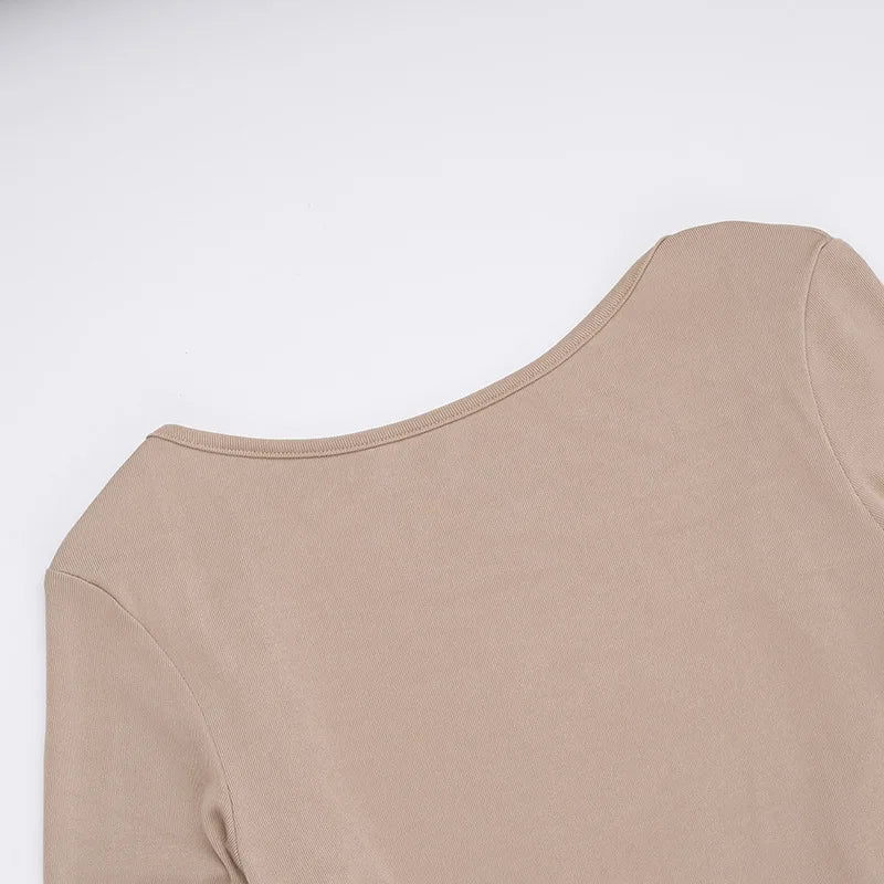 Elegant off shoulder evening dress in beige showcasing a smooth fabric and stylish neckline