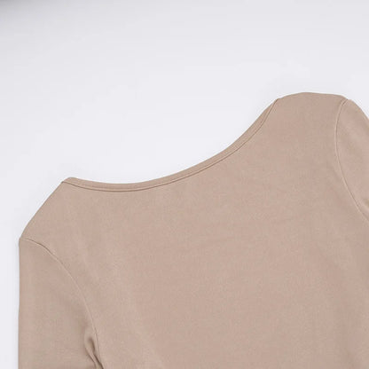 Elegant off shoulder evening dress in beige showcasing a smooth fabric and stylish neckline