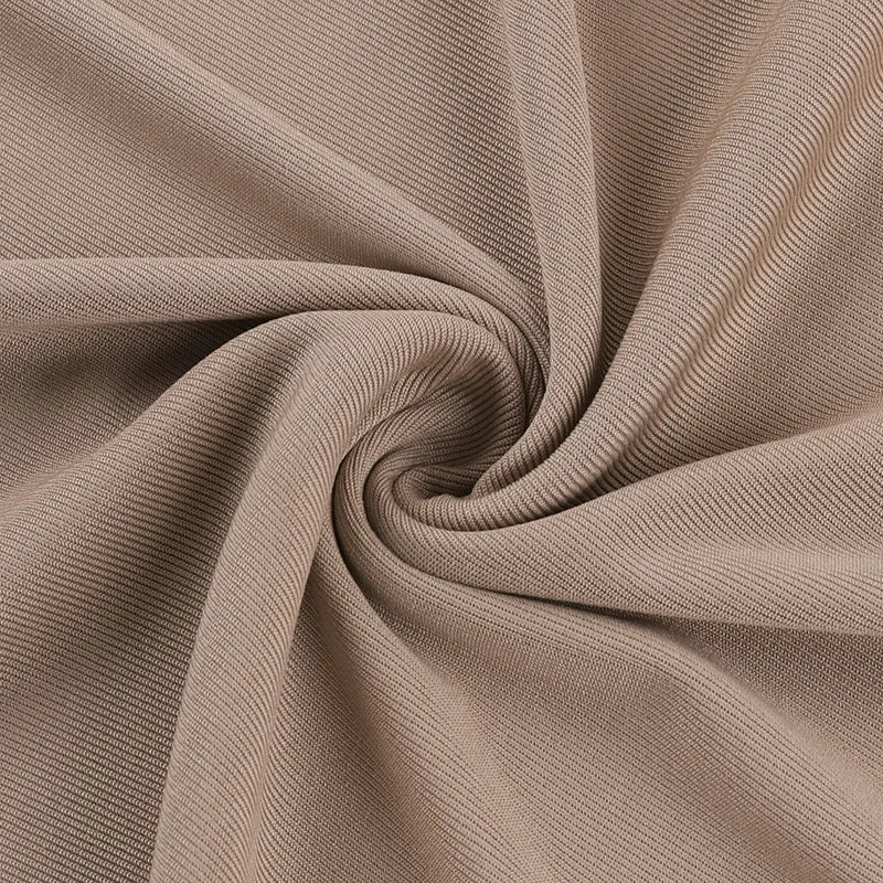Soft beige fabric showcasing texture for an elegant off shoulder evening dress