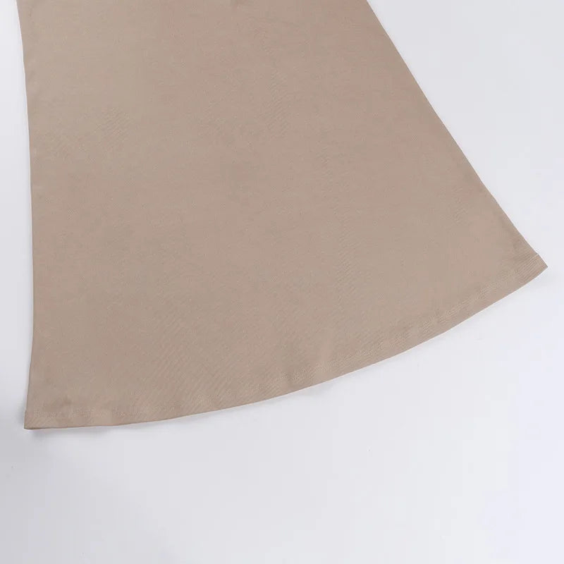 Elegant off shoulder evening dress in soft beige fabric flowing elegantly for special occasions