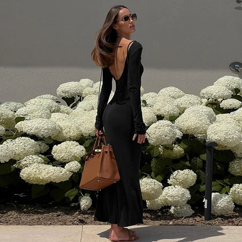 EtherealBe elegant off shoulder evening dress in black with a back cutout design and flowing silhouette