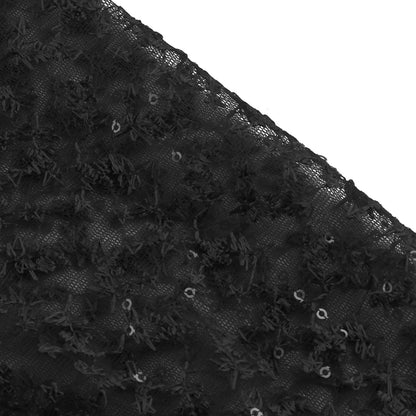 Close-up of delicate fabric texture used in elegant prom and gala dresses, featuring intricate floral patterns