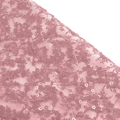 Close-up of luxurious fabric for elegant prom and gala dresses with intricate sequins in a soft pink hue