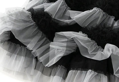 EtherealBe elegant ruffle edge skirt for women featuring layers of black and white tulle fabric