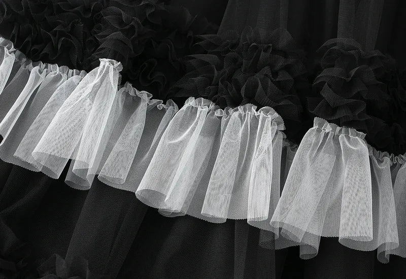 Close-up of an elegant ruffle edge skirt for women showcasing layered tulle texture in black and white