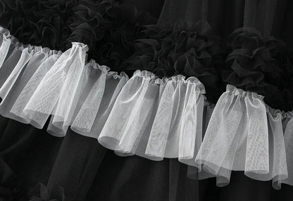 Close-up of an elegant ruffle edge skirt for women showcasing layered tulle texture in black and white