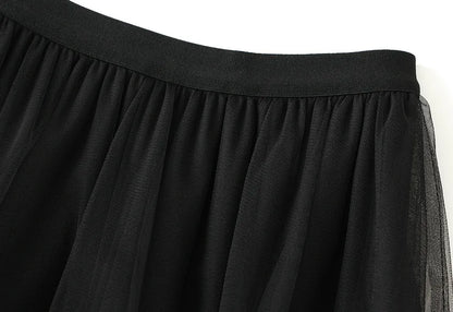 EtherealBe elegant ruffle edge skirt for women in black with soft, flowing fabric