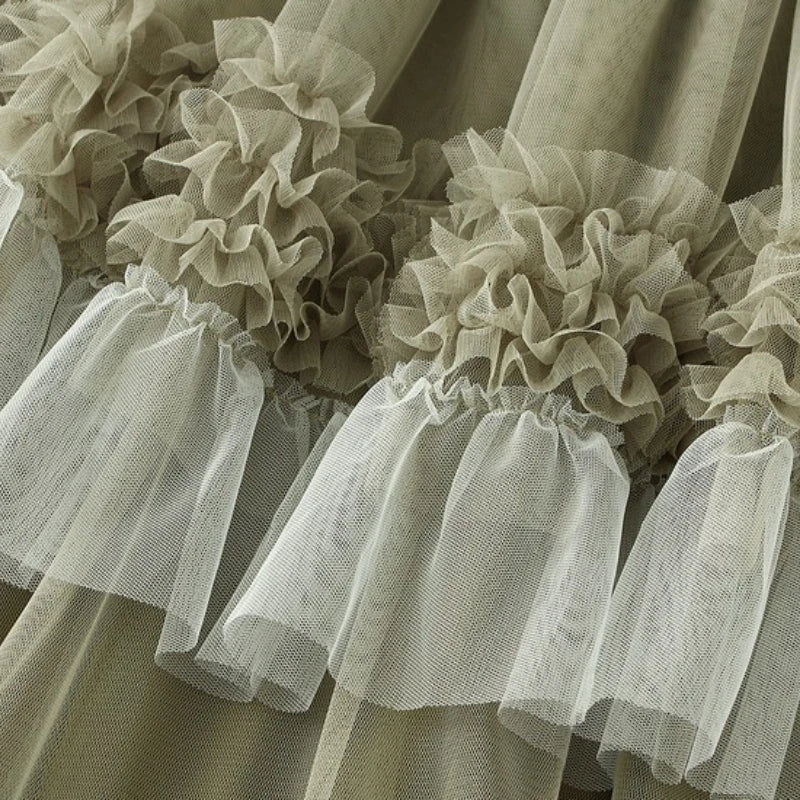 Close-up of elegant ruffle edge skirt for women featuring layered tulle ruffles in a soft color