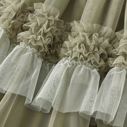 Close-up of elegant ruffle edge skirt for women featuring layered tulle ruffles in a soft color