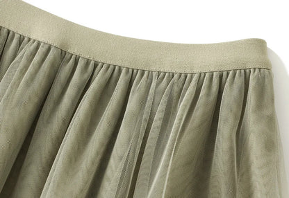 EtherealBe elegant ruffle edge skirt for women in soft green fabric with detailed pleats