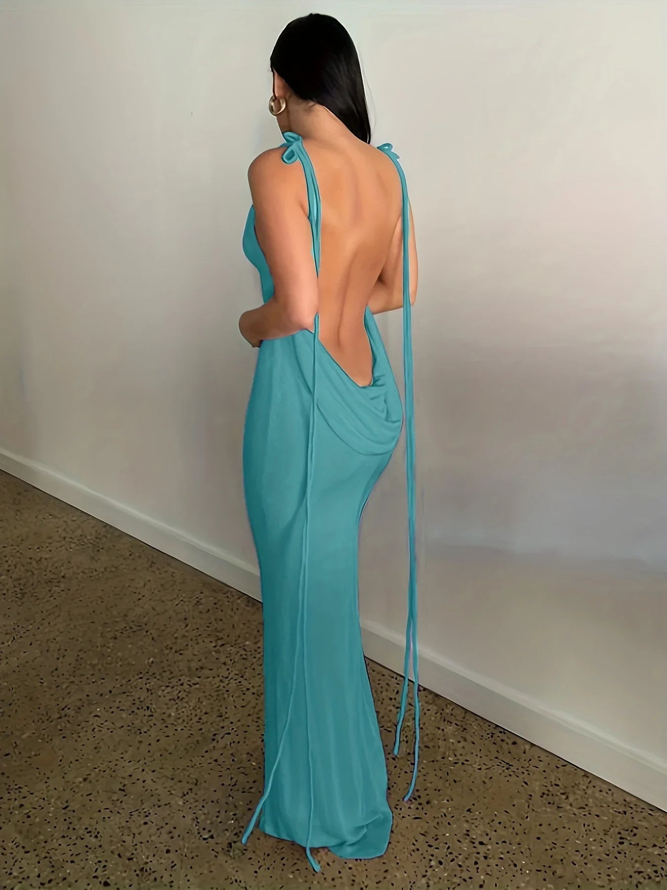 Elegant womens strapless evening gown in turquoise with back draping and tie details for formal events