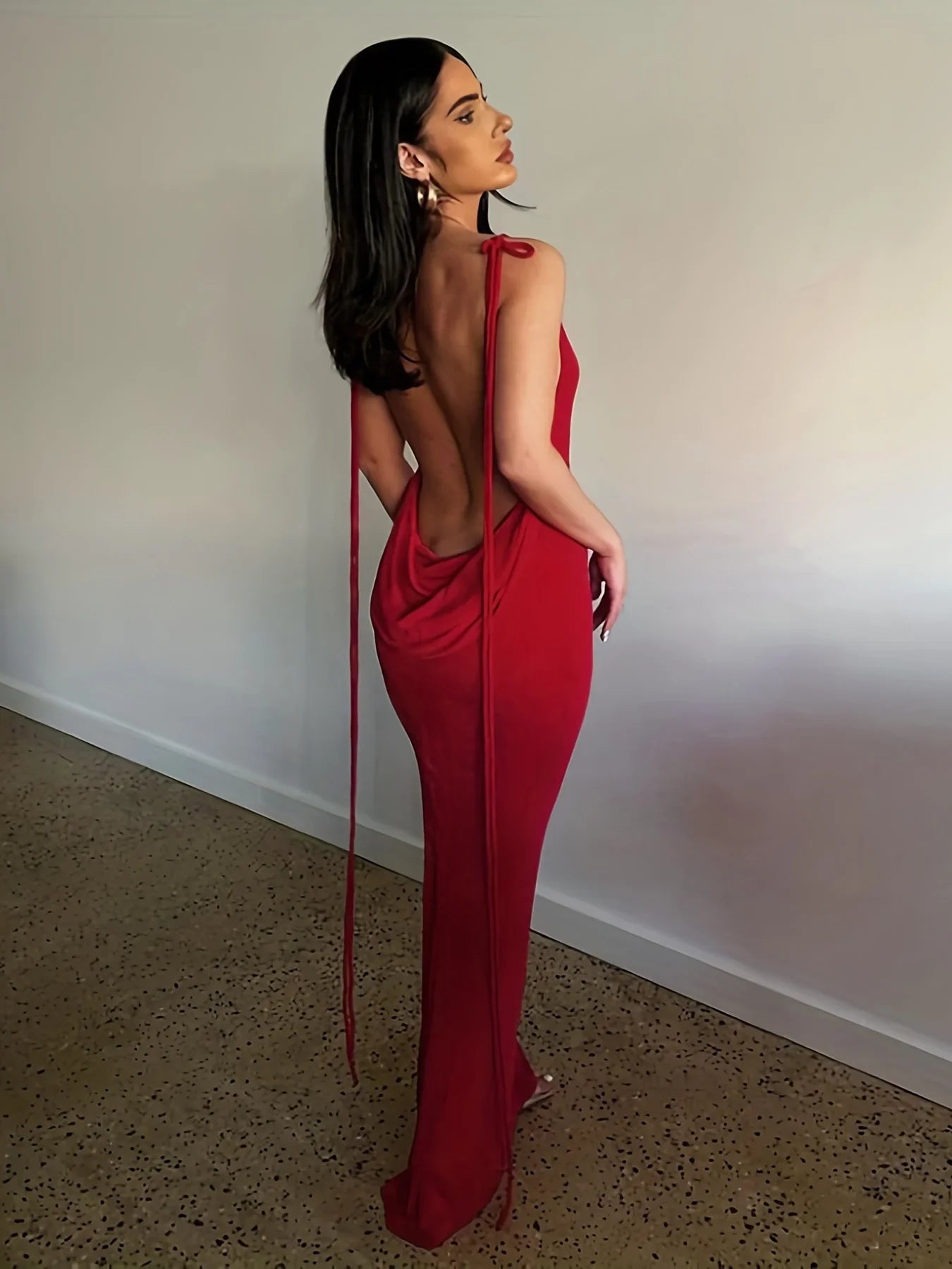 EtherealBe elegant womens strapless evening gown in red with a backless design and flowing fabric