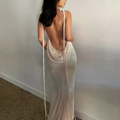 Model wearing an elegant womens strapless evening gown in a sleek design with a backless style