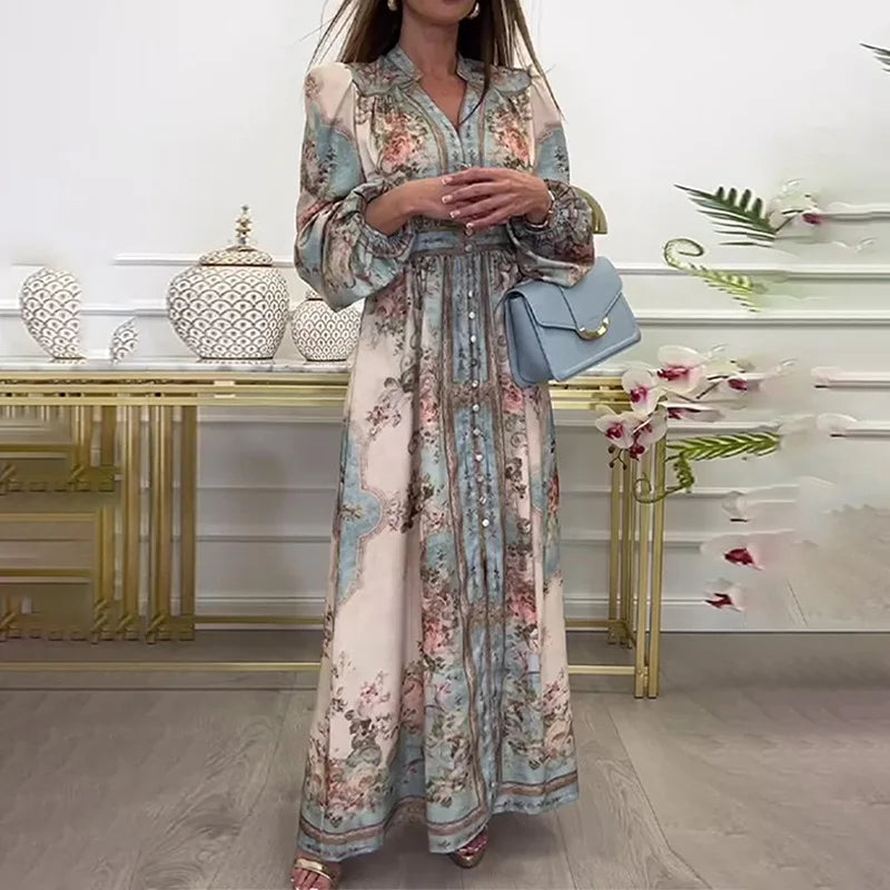 Woman wearing a floral long sleeve maxi vintage autumn dress for women with waist tie holding a light blue handbag