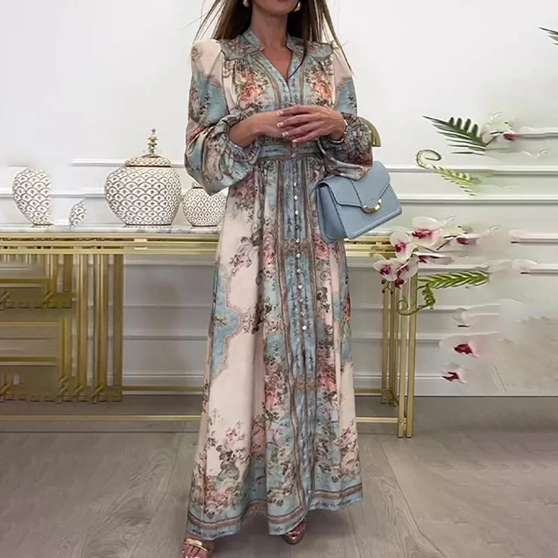 Woman wearing a floral maxi vintage autumn dress for women with long sleeves waist tie and blue handbag