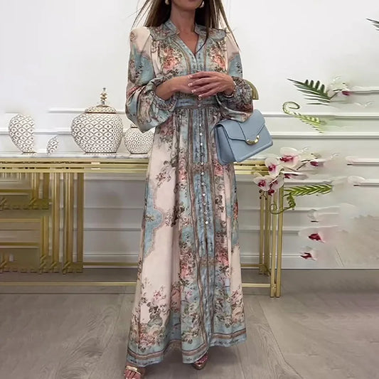 Woman wearing a floral maxi vintage autumn dress for women with long sleeves waist tie and blue handbag