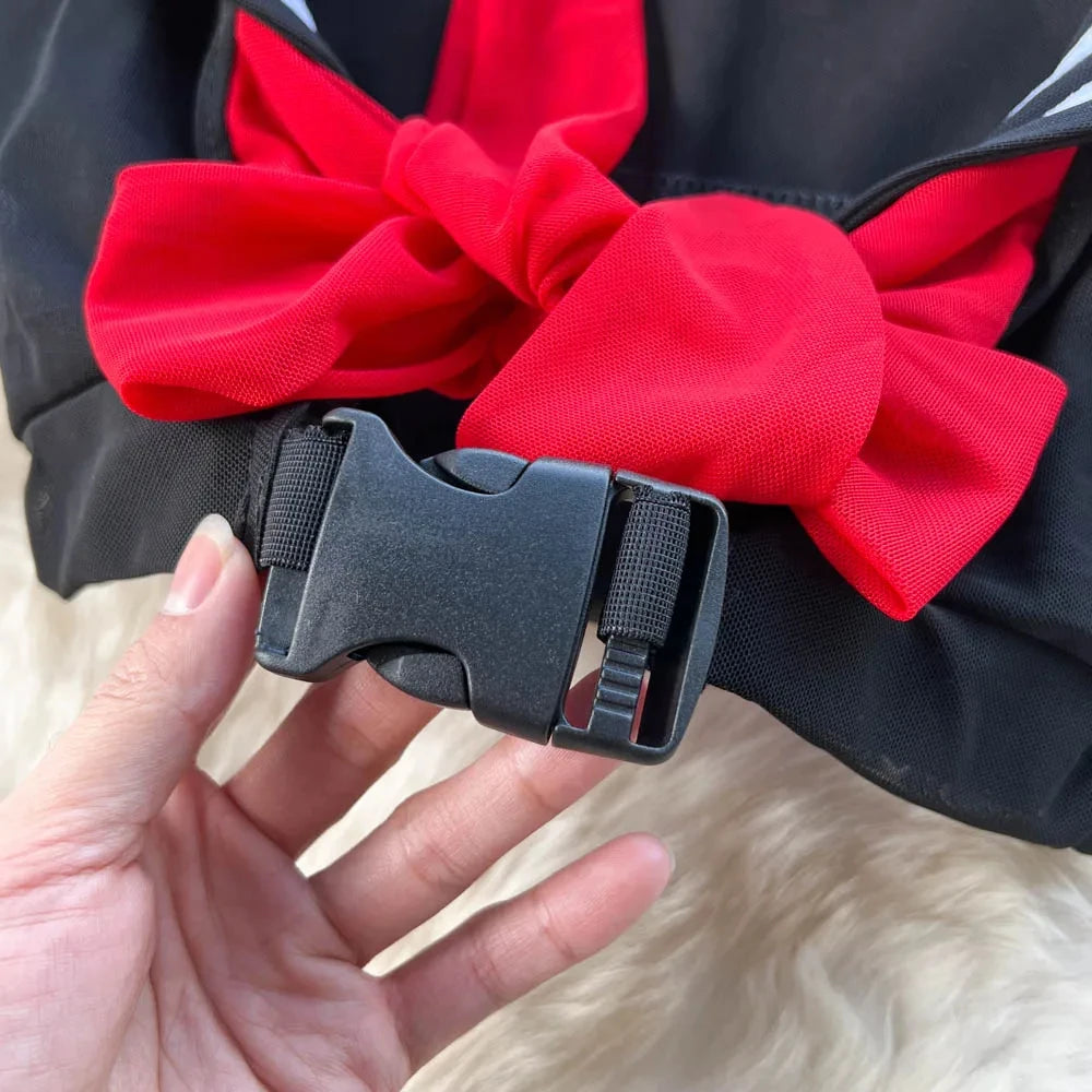 Close-up of the buckle and red bow on the EtherealBe erotic sailor cosplay costume