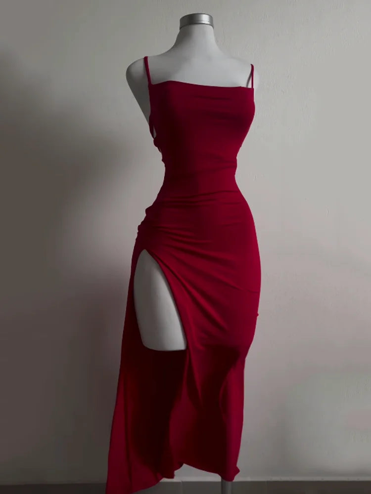 EtherealBe high slit backless evening dress in deep red, featuring strappy design and elegant silhouette