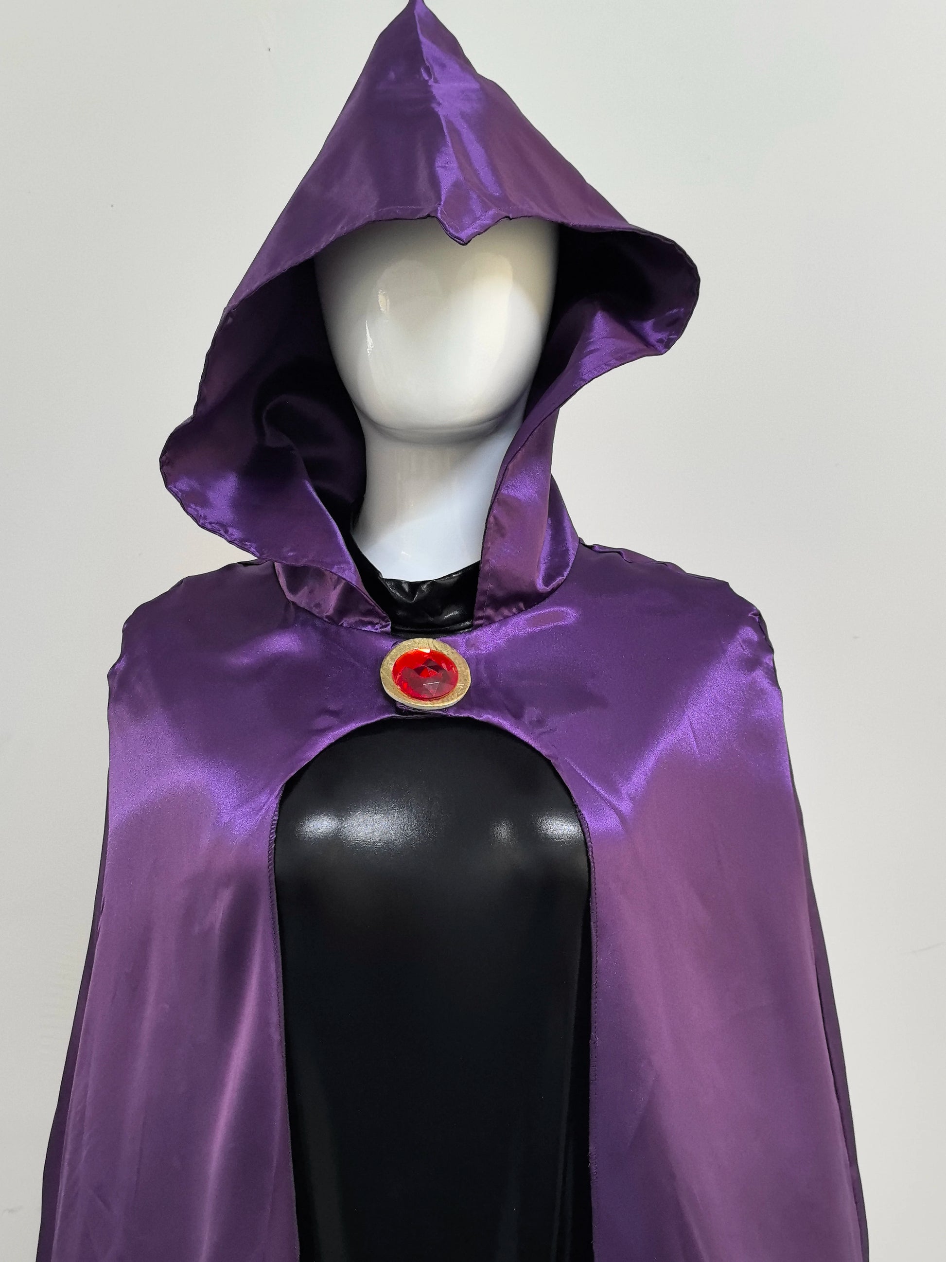 Raven Teen Titans cosplay costume featuring a purple hooded cape with a circular red gem detail
