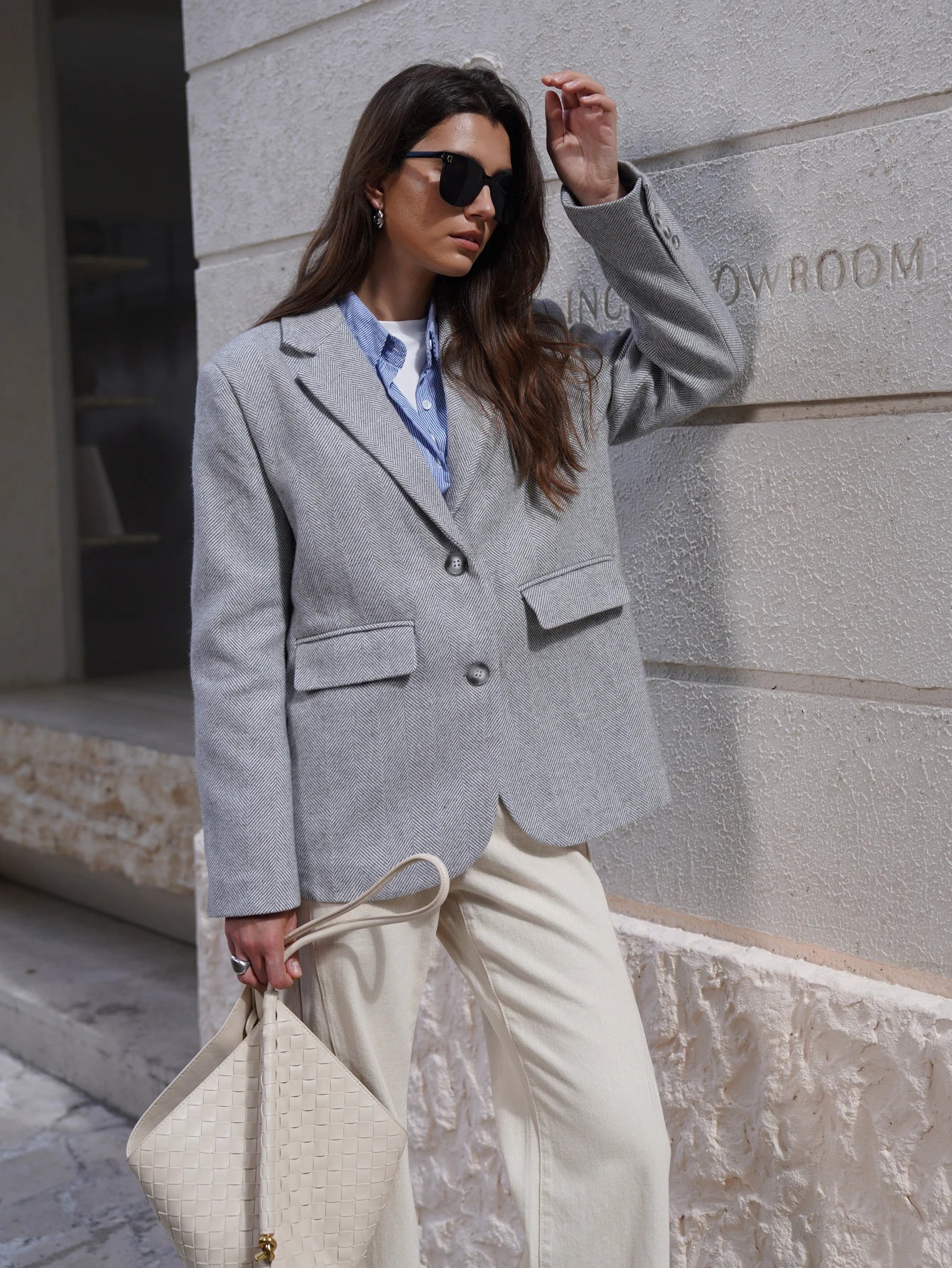 Stylish gray Fashion Blazer for women paired with casual wear and sunglasses in an outdoor setting