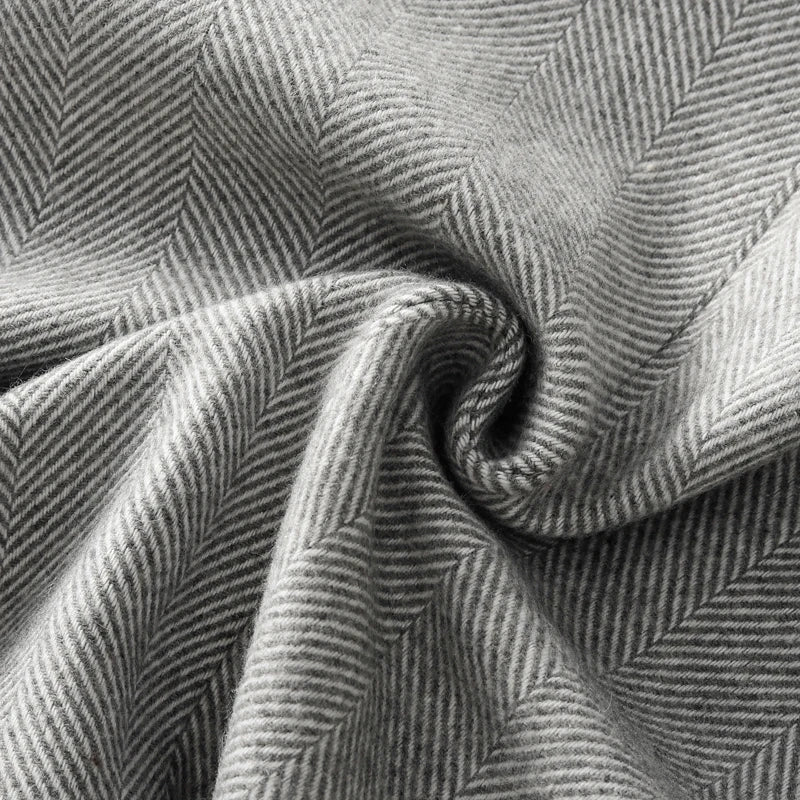 Textured gray fabric showcasing herringbone pattern for a Fashion Blazer for women