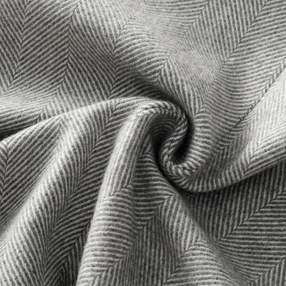 Textured gray fabric showcasing herringbone pattern for a Fashion Blazer for women