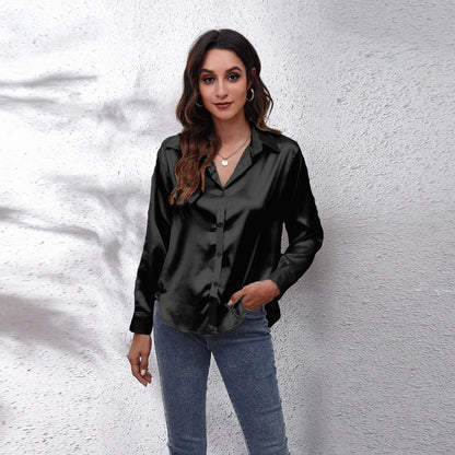 Elegant black fashion satin blouse ladies with button front and long sleeves, styled with jeans