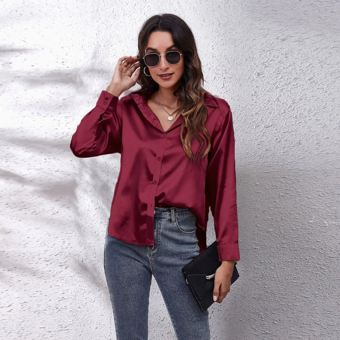 Elegant burgundy fashion satin blouse ladies styled with casual jeans and accessories