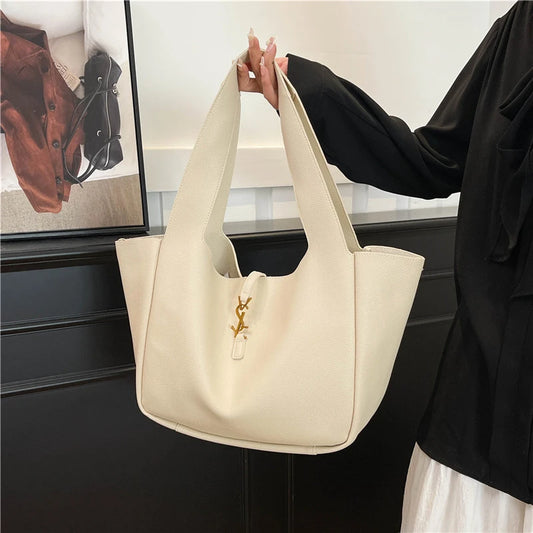 EtherealBe fashionable tote bag for women in cream color, featuring a sleek design and sturdy straps