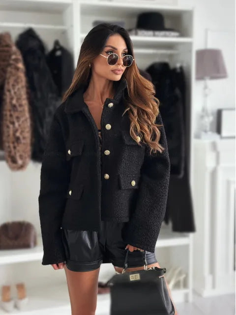 Chic model wearing a fashionable woolen short coat for women, paired with stylish sunglasses and a handbag