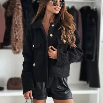 Fashionable woolen short coat for women styled with sunglasses and leather shorts