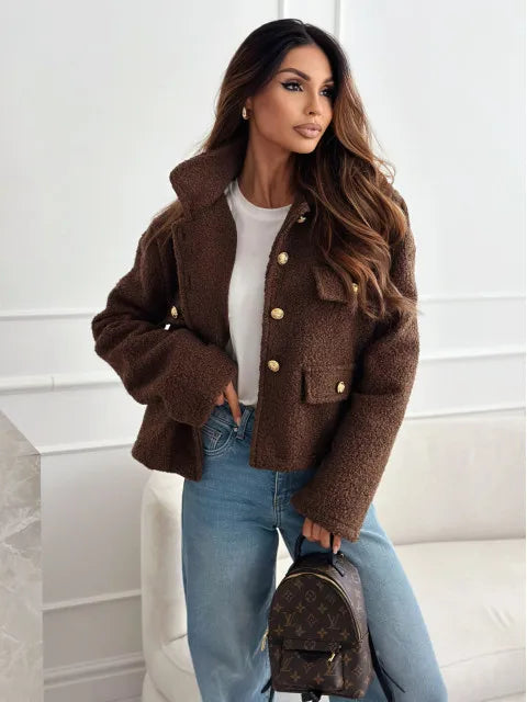Fashionable woolen short coat for women in brown, styled with high-waisted jeans and a chic bag