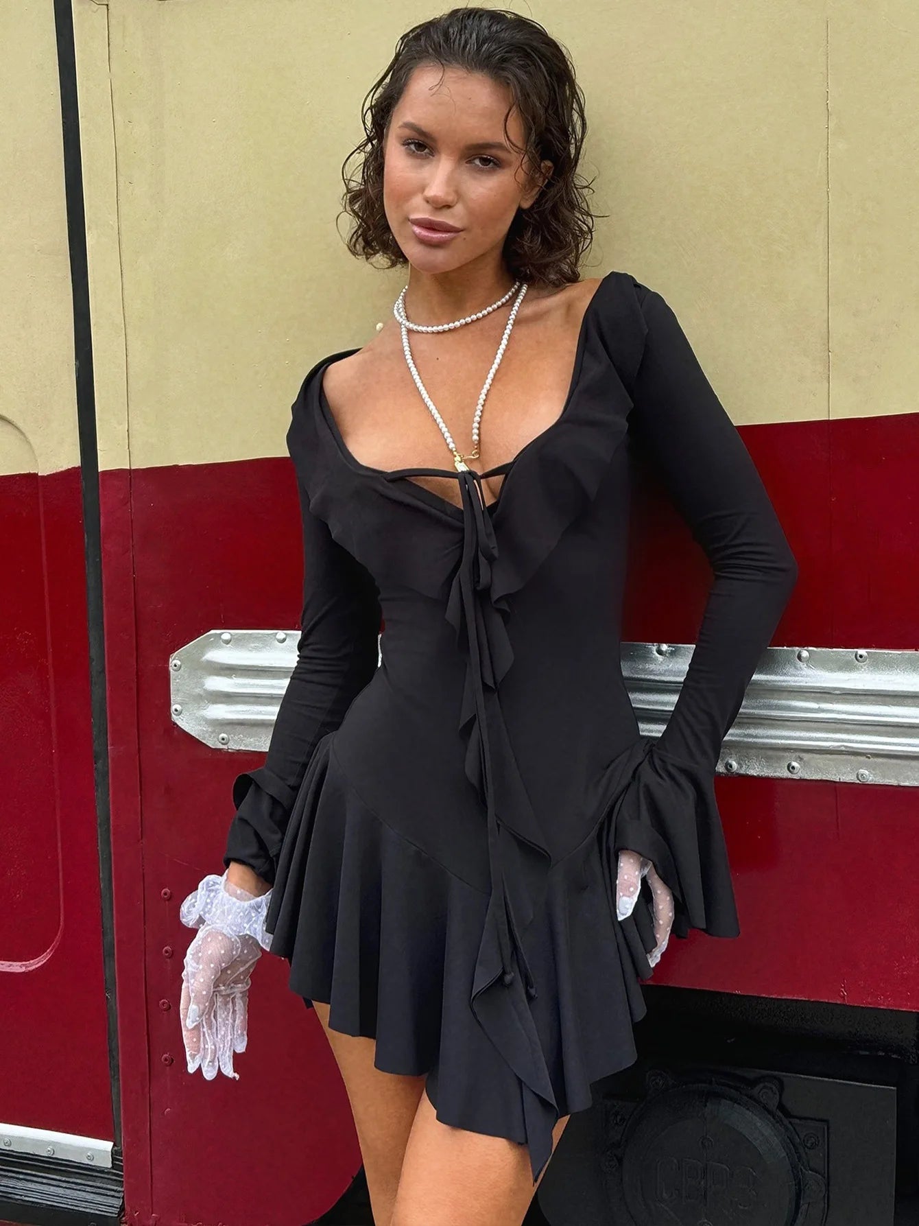 EtherealBe Flared sleeved v neck ruffle dress in black with stylish detail for a chic look