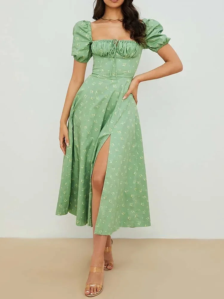 Elegant green floral print maxi dress with puff sleeves and thigh-high slit for summer occasions