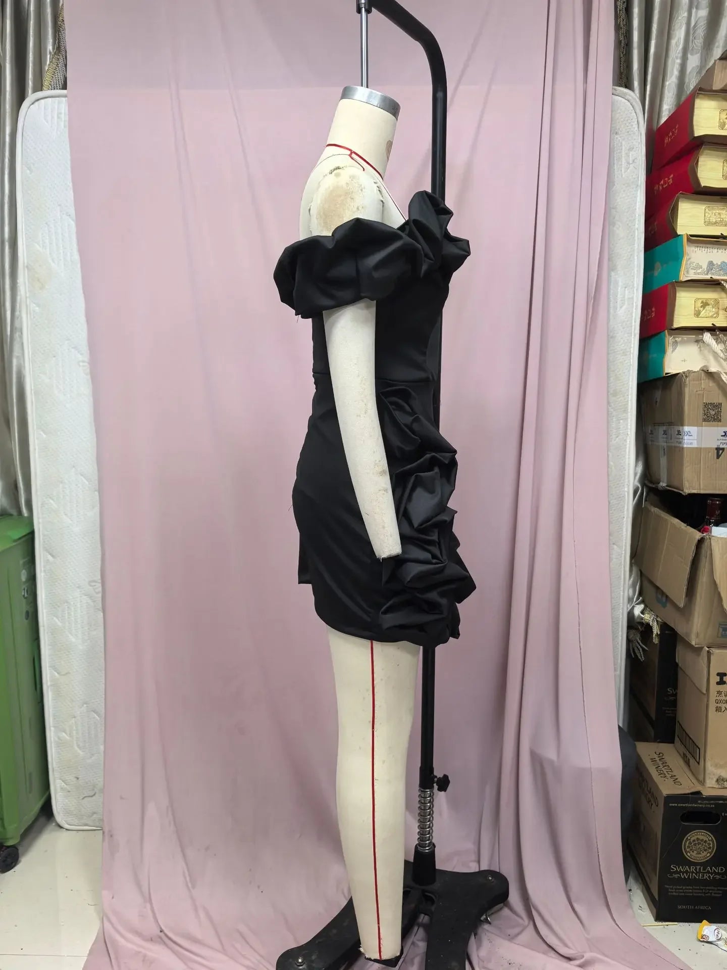 Stylish formal strapless cocktail dress with ruffled detailing showcased on a mannequin