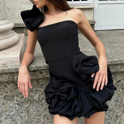 Elegant black formal strapless cocktail dress with ruffled detailing and chic asymmetrical sleeve