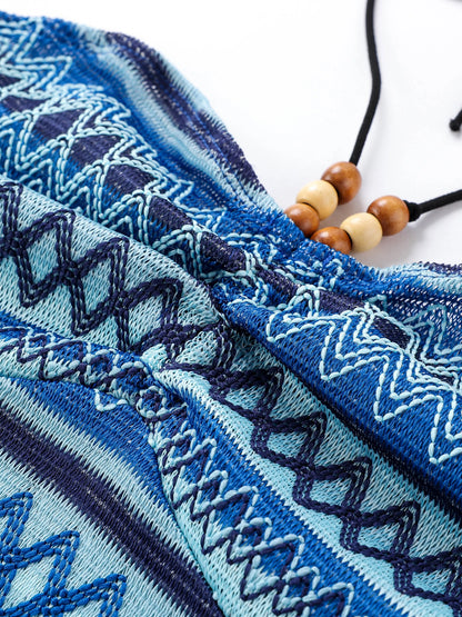 Close-up of EtherealBe geo pattern beaded halter crop top showcasing intricate blue designs and adjustable ties