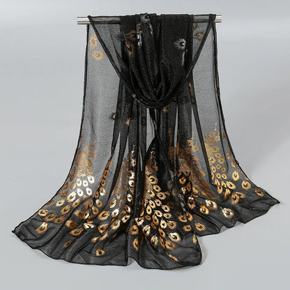Elegant gold stamped peacock scarf with a stylish black base for a chic and trendy look