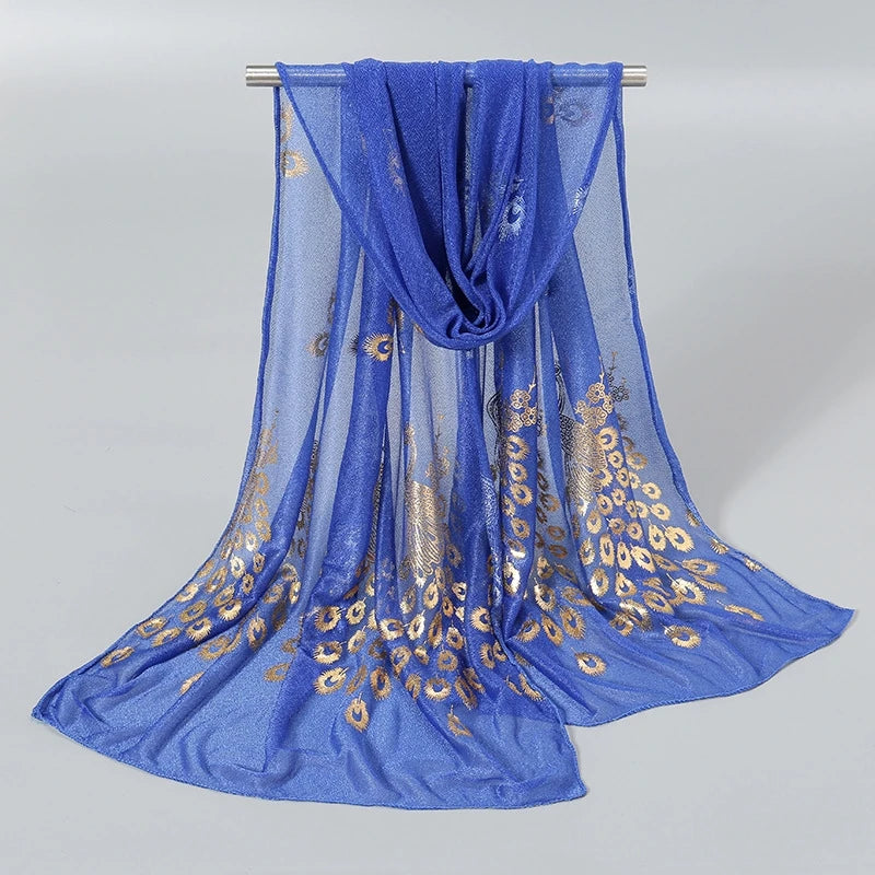 Elegant blue scarf featuring gold stamped peacock design, perfect for adding a touch of luxury