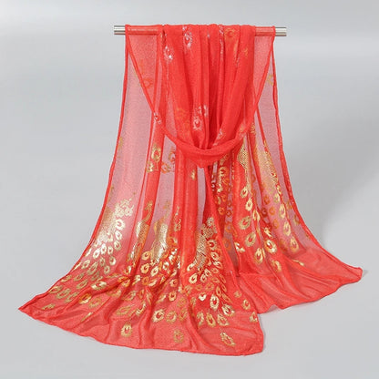 Gold stamped peacock scarf in vibrant red, featuring intricate peacock designs for a stylish accessory