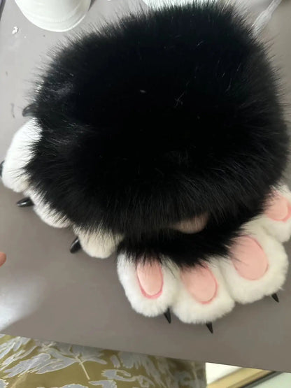 Top view of Halloween faux fur cat claw mittens with black fur and pink paw details
