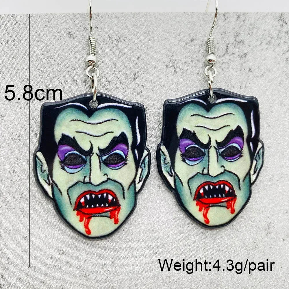 EtherealBe Halloween horror earrings in the shape of a vampire's face with fangs and blood