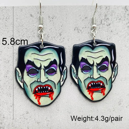 EtherealBe Halloween horror earrings in the shape of a vampire's face with fangs and blood