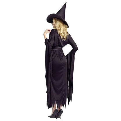 Elegant woman in a black Halloween witch costume with long sleeves and a pointed hat