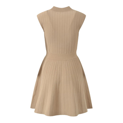 Back view of a beige V-neck sleeveless fall dress for women with a pleated design