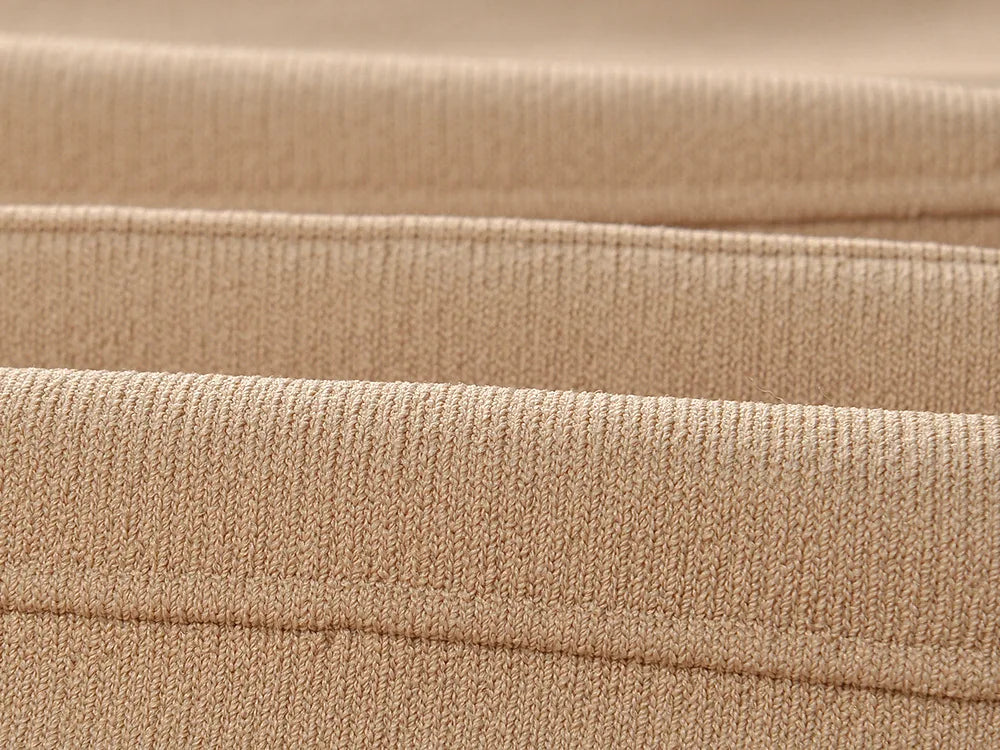 Close-up of soft beige fabric showing texture of V-neck sleeveless fall dress for women