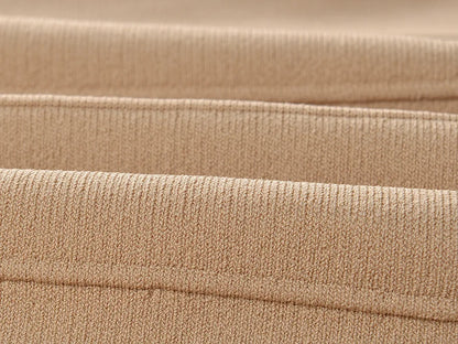 Close-up of soft beige fabric showing texture of V-neck sleeveless fall dress for women